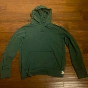 Green Reigning Champ hooded sweatshirt.